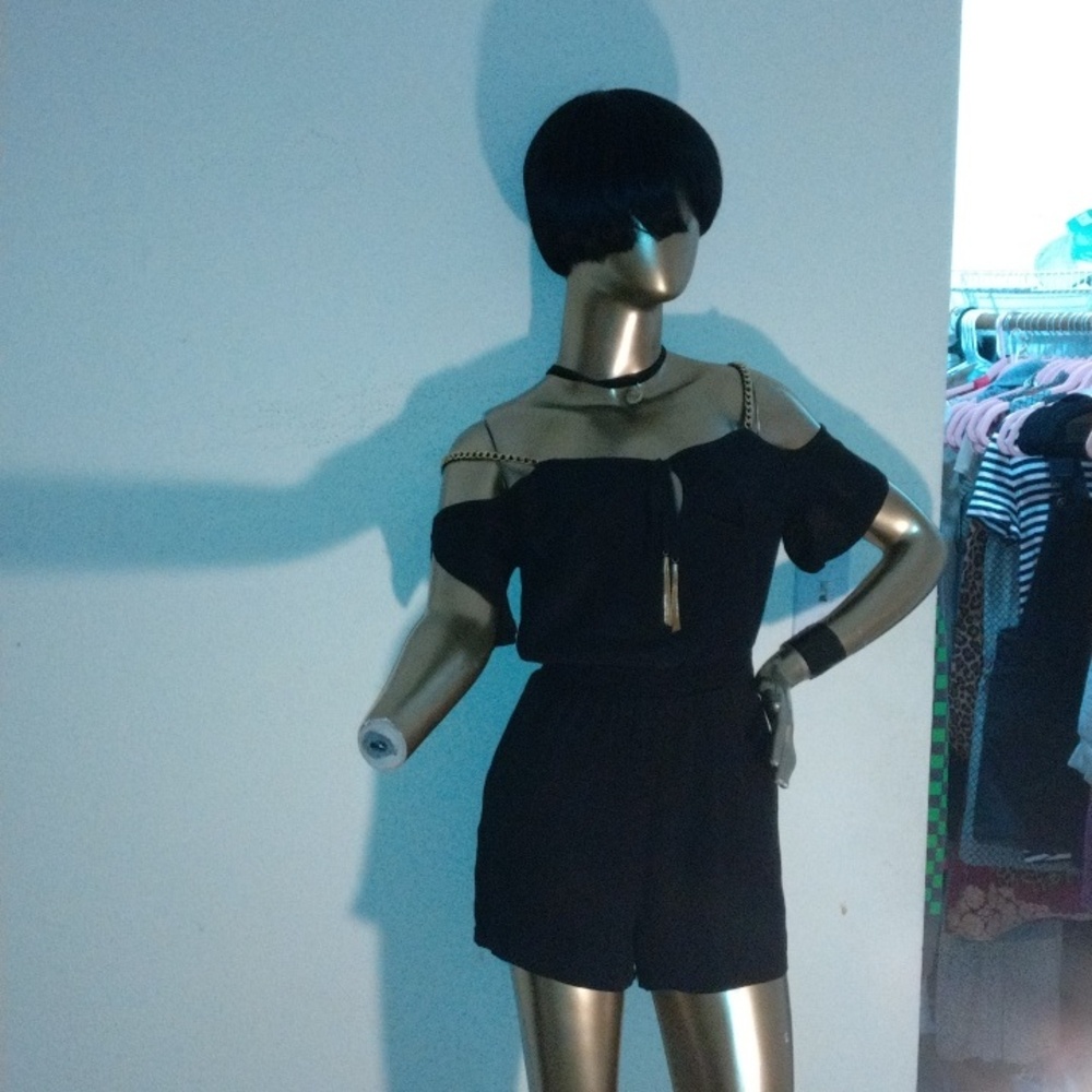 bebe black chain jumpsuit size small